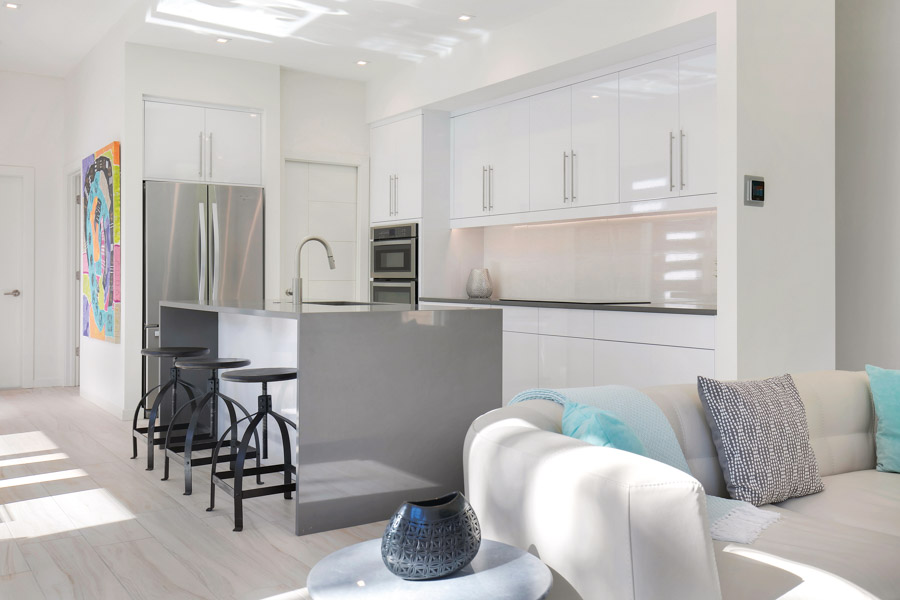 Clean lines and modern finishes continue into the interior living spaces and kitchen area. 