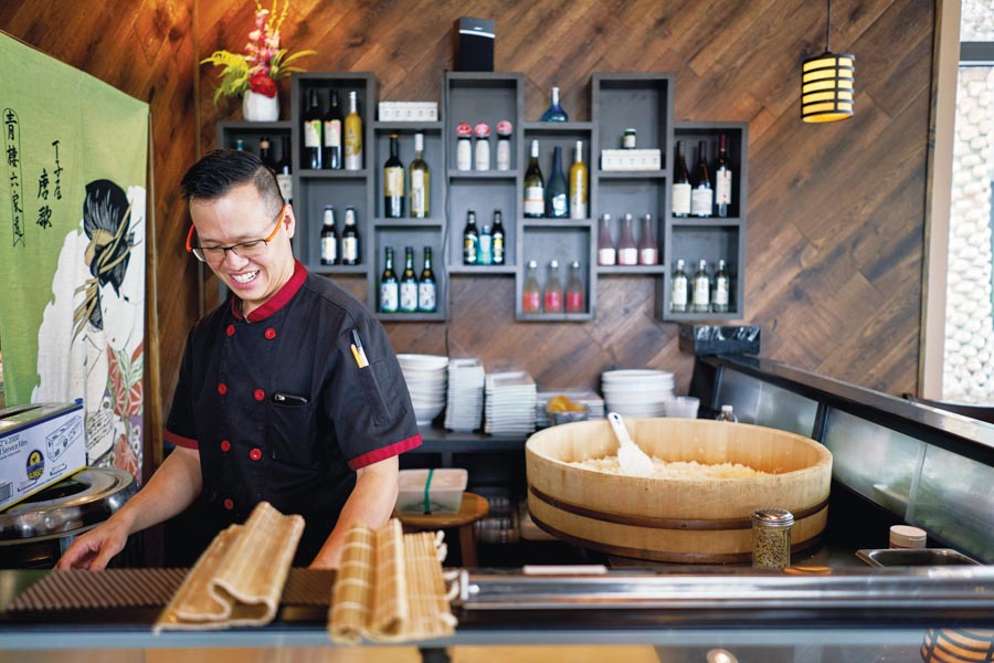 Simon Ng Fung sets up his sushi station. Photography by Wyatt Kostygan.
