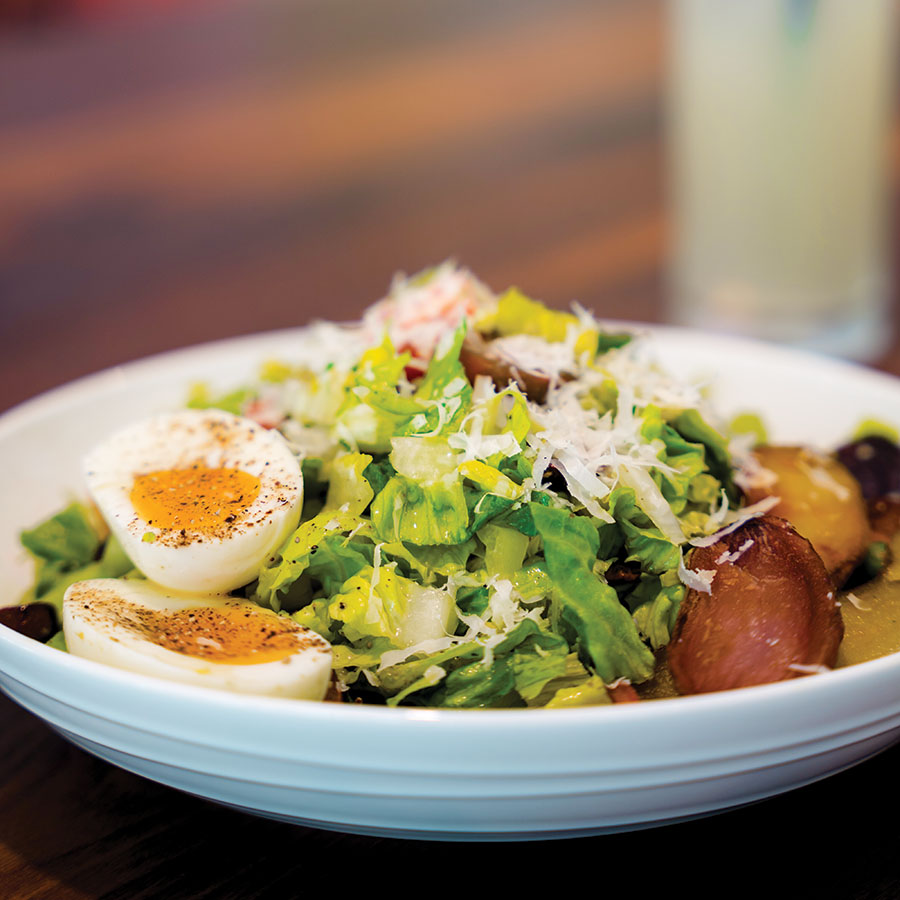 The Lyonnaise Salad will not leave you hungry. Photography by Wyatt Kostygan